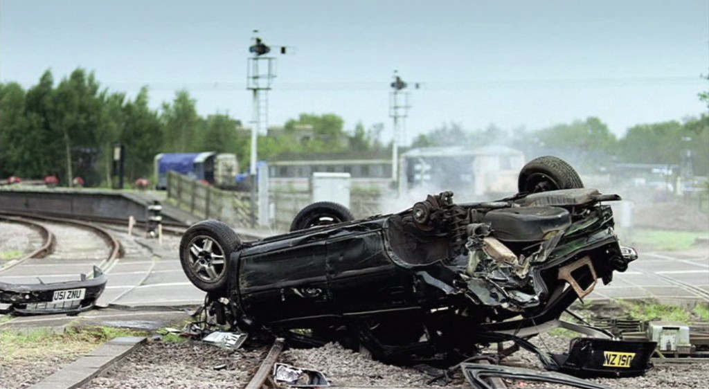 7. Still image of upturned car from TV advert [online]